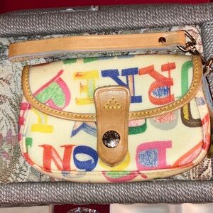 EUC Dooney & Bourke clutch style wristlet with rainbow hearts and stars